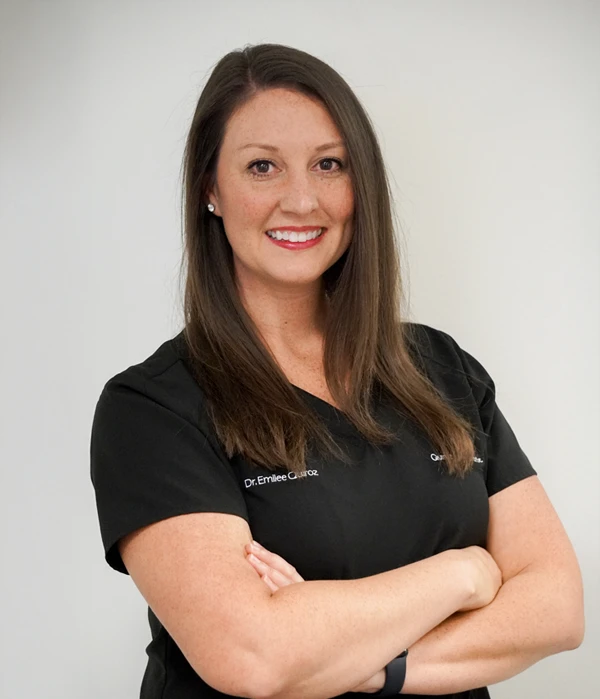 Chiropractor Carrollton TX Emilee Quiroz HP Chiropractor Emilee Quiroz smiling, while wearing a black shirt.