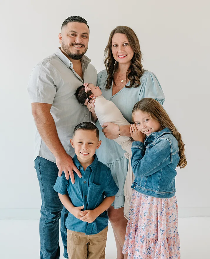 Chiropractor Richardson TX Pierre Quiroz And Emilee Quiroz With Family HP NEW 1 Pierre Quiroz and Emilee Quiroz smiling with their kids.